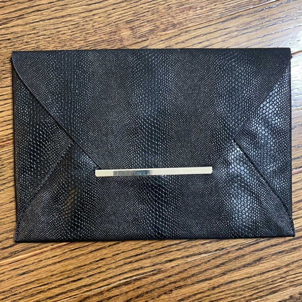 BCBG like new black leather snakeskin clutch
